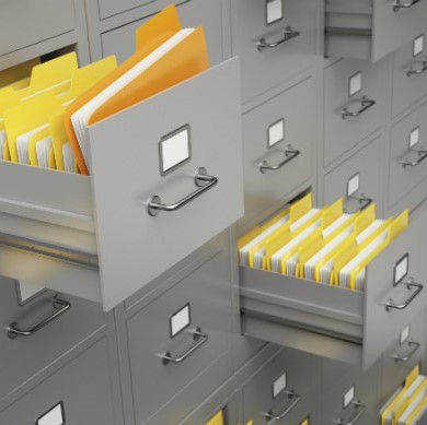 several filing cabinets with two drawers open showing many yellow file folders